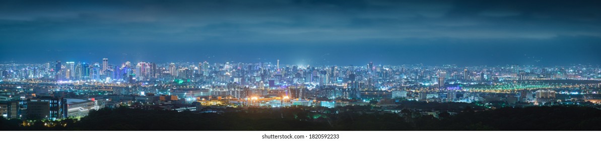 Panorama night view of Taichung City - Asia business city concept image, panoramic modern metropolis bird’s eye view at evening, shot in Wanggaoliao Night View Park, Taichung, Taiwan.