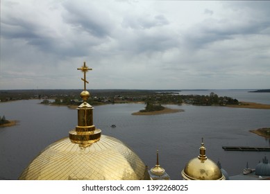 Panorama of the Nilo-Stolobensky desert in the Tver region on the background of lake Seliger with the dome of the Epiphany Cathedral of the monastery. Tver region, Russia