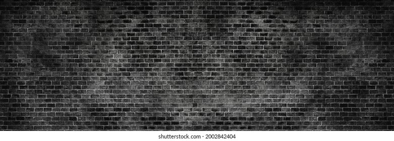 Panorama old black brick texture detail background. House, shop, cafe and office design backdrop. Paint brickwork wall and copy space.