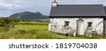Panorama of old irish cottage on the Dingle peninsula, View of great Blasket Island in the background.