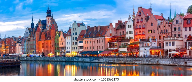 Panorama of Old Town of Gdansk, Dlugie Pobrzeze and Motlawa River at night, Poland - Shutterstock ID 1561562173