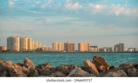 Panorama On City Clearwater Beach FL. Summer Vacations In Florida. Beautiful View On Hotels And Resorts On Island. Blue Color Of Ocean Water. American Coast Or Shore. Sand Key Park In Gulf Of Mexico.