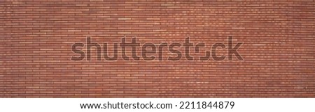 panorama orange brown old brick wall panel exterior design abstract background.idea for construction material backdrop,vintage or retro wallpaper design.