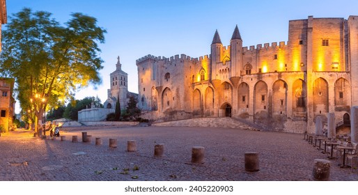 Panorama of Palace of the Popes and Avignon Cathedral during evening blue hour, Avignon, France - Powered by Shutterstock