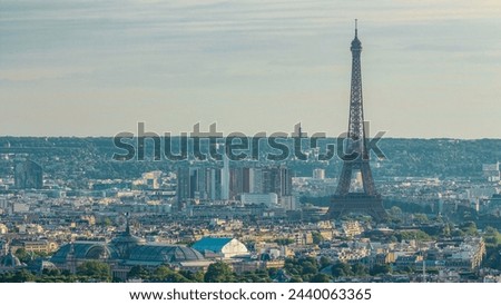 Panorama of Paris from above timelapse with Eiffel tower, France. Aerial top view from Montmartre viewpoint. Sunny day with blue cloudy sky at the evening