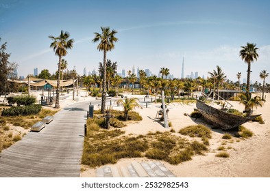 Panorama of Persian Gulf with beach and skyscrapers with hotels and residences on horizon. Palm, wooden boardwalk, traditional dhow boats perfect backdrop for relaxing vacation in arabian paradise - Powered by Shutterstock