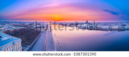 Panorama of Peter. White night in Petersburg. Vasilievsky Island. City of Russia. View of the Neva River. The dawn over Petersburg.