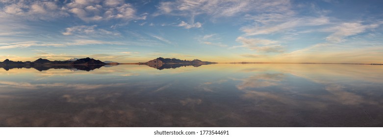 Panorama photo of the Bonneville salt flats in Utah, USA and the expansive reflections during sunset - Powered by Shutterstock