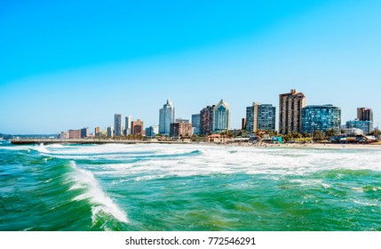 Panorama photo of Durban South Afrika. Big waves crossing the scene - Shutterstock ID 772546291