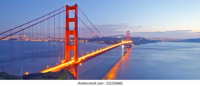 Panorama photo of Golden Gate Bridge at night time, San Francisco, USA - Powered by Shutterstock