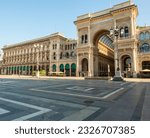 panorama of piazza del Duomo with the monumental entrance to the historic Galleria Vittorio Emanuele, an elegant meeting place and international center of luxury shopping 