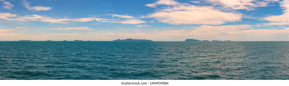 Panorama Picture Of Horizon Tropical Thailand Island With Green Sea, Blue Sky For Summer Vacation Concept. Copy Space Background.