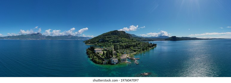Panorama of punta san vigilio. Aerial view of Parco Baia delle Sirene, Lake Garda, Italy. Top view of baia delle sirene on the coastline of Lake Garda. Baia delle Sirene on the coastline.