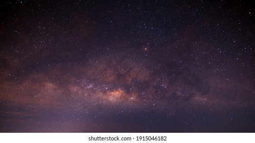Panorama purple and blue night sky milky way and star on dark background.with noise and  grain.Photo by long exposure and select white balance.