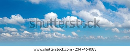 Panorama of real blue sky during daytime with white light clouds Freedom and peace. Large photo format Cloudscape blue sky