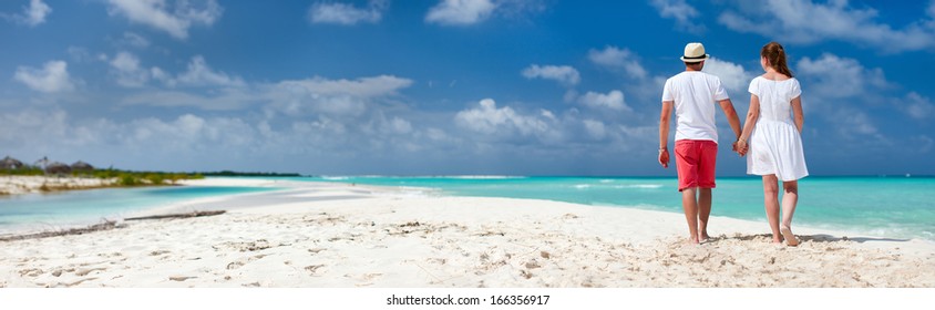 Panorama Of A Romantic Couple At Caribbean Beach