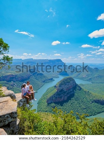 Panorama Route South Africa, Blyde river canyon with the three rondavels, view of three rondavels and the Blyde river canyon in South Africa. Asian women and Caucasian men visiting South Africa 