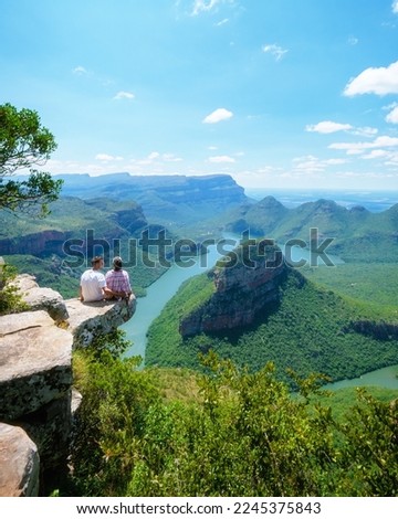 Panorama Route South Africa, Blyde river canyon with the three rondavels, view of three rondavels and the Blyde river canyon in South Africa. Asian women and Caucasian men on vacation in South Africa