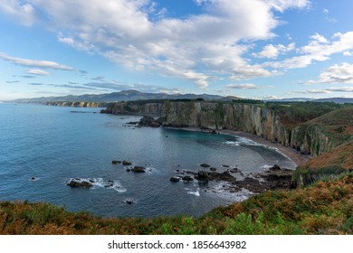 A panorama of rugged coastline in northern Spain during autumn