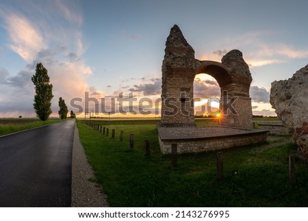 Panorama of the ruins of the triumphal arch Heathens' Gate in Carnuntum during sunset