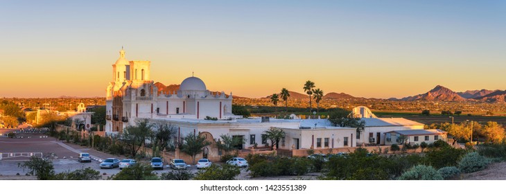 Panorama of San Xavier Mission Church in Tucson, Arizona, at sunrise. This historic spanish catholic mission was founded in 1692 and is located on the Tohono O'odham Nation indian reservation.