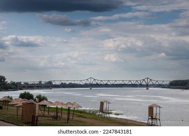 Panorama of the sava river in Sabac, serbia, with a focus on the Zeleznicki most, a steel railway bridge, in front of the city beach. Sabac is a Serbian city in the macva region.