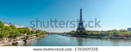 Panorama of Seine in Paris and Eiffel tower in beautiful summer day in Paris, France
