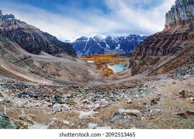Panorama of Sentinel Pass in the Canadian Rockies at Moraine Lake with Mount Temple and Eiffel Peak, nicknamed Eiffel Tower, opening up to Larch Valley with the famous snow-capped Valley of Ten Peaks.