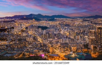 Panorama of Seoul city skyline and skyscrapers at night with Namsan Mountain and Bukhansan in the background, Seoul, South Korea. - Powered by Shutterstock