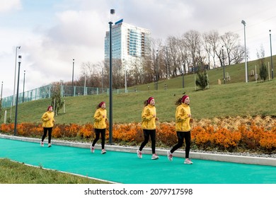 panorama with several images of the same female jogger on a running track against an urban background