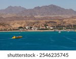 Panorama of Sharm el-Sheikh, Sharm El Maya bay. Excursion submarines, Red sea and Sinai mountains on a background. Boat trips and sightseeing in Egypt, Sharm el-Sheikh. 