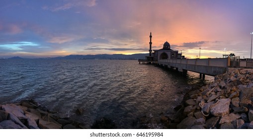 Panorama shot of Floating Mosque located at Penang Port, Butterworth, Penang, Malaysia. Soft Focus, Motion blur due to long exposure shot. vibrant colors. Copy Space Area
