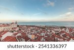 Panorama showing aerial view of Alfama in Lisbon timelapse during sunset. Red roofs in the oldest district of the Old Town, with National Pantheon from belvedere Miradouro das Portas do Sol, Portugal.