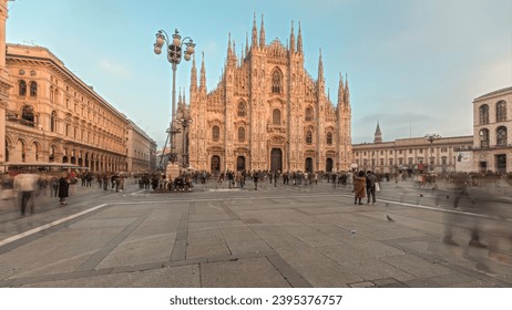 Panorama showing Milan Cathedral and historic buildings timelapse during sunset. Duomo di Milano is the cathedral church located at the Piazza del Duomo square in Milan city in Italy