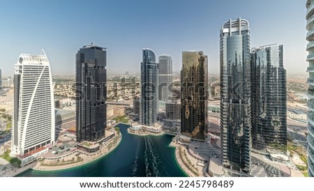 Panorama showing tall residential buildings at JLT district aerial , part of the Dubai multi commodities centre mixed-use district. Villa houses on a background