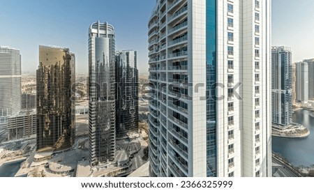 Panorama showing tall residential buildings at JLT district aerial, part of the Dubai multi commodities center mixed-use district. Villa houses on a background