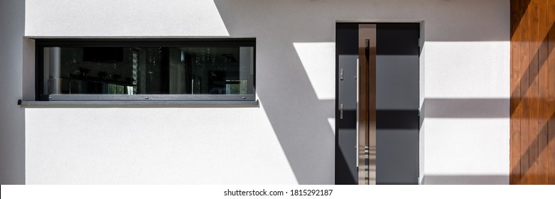 Panorama Of Simple Front Doors And Long Window In White Facade House, Exterior View