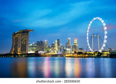 Panorama of Singapore city skyline by night - Powered by Shutterstock