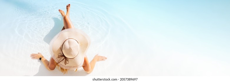 Panorama sized banner of woman relaxing on tropical beach, view from above