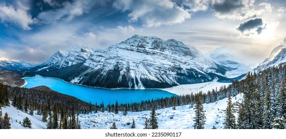 Panorama of a snow covered mountain lake. Winter mountain snow lake. Lake in snowy mountains. Mountain lake in snow - Powered by Shutterstock