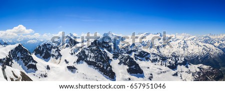 Panorama of the snow mountain range mountain range from the Titlis is a mountain of the Uri Alps Engelberg, Switzerland.