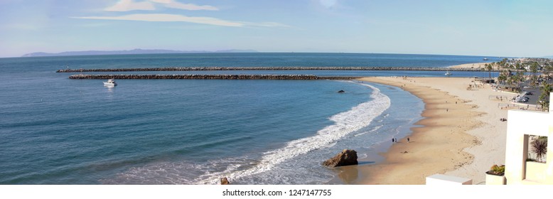 Panorama Of Southern California Coastline. View Of The Coastal Access To The Harbor From A Rocky Cliff. Cityscape Of The Marina. Corona Del Mar, Newport Beach, California