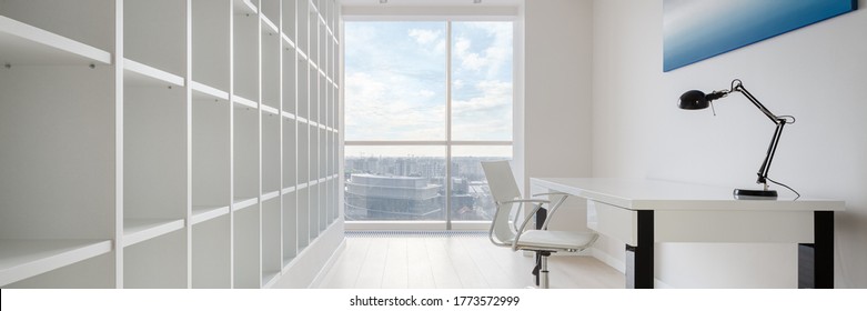 Panorama Of Spacious Home Office In White With Big Bookcase And Desk And With Stunning City View