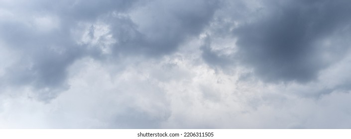 Panorama of stormy sky with gray clouds