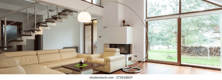 Panorama of stylish living room with big window