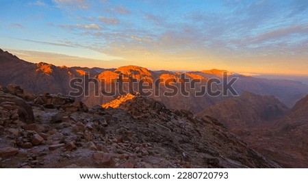Panorama of the sunrise seen from the Mount Moses (Mount Sinai). Beautiful mountain scenery in Egypt, Sinai peninsula, North Africa