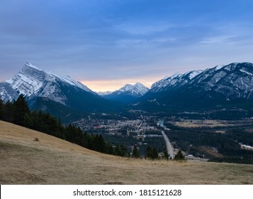 Panorama Sunrise View Of Mount Rundle And Banff Town In Banff National Park In Alberta, Canada. Seen From A Vantage Point On The Road To Mount Norquay.