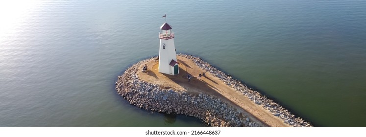 Panorama Sunset Over Lighthouse At East Wharf On Lake Hefner, Oklahoma City, Oklahoma, USA In Aerial View. A 36 Feet Tall Building Inspired By A 1700s New England Lighthouse