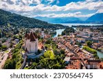 Panorama of Thun city with Alps and Thunersee lake, Switzerland. Historical Thun city and lake Thun with Bernese Highlands swiss Alps mountains in background, Canton Bern, Switzerland.