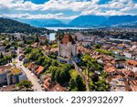 Panorama of Thun city with Alps and Thunersee lake, Switzerland. Historical Thun city and lake Thun with Bernese Highlands swiss Alps mountains in background, Canton Bern, Switzerland.